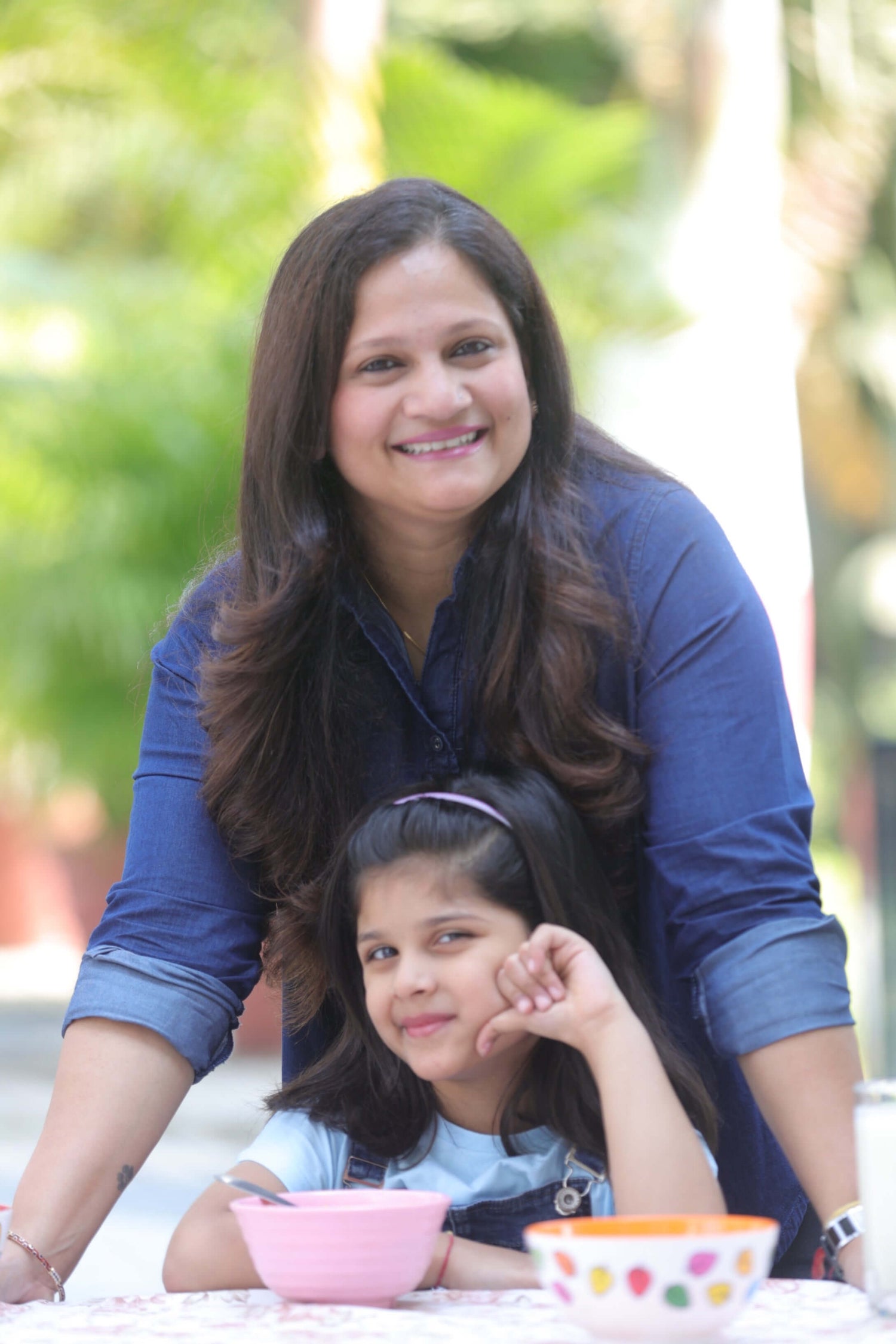 Akanksha and Prisha at a table